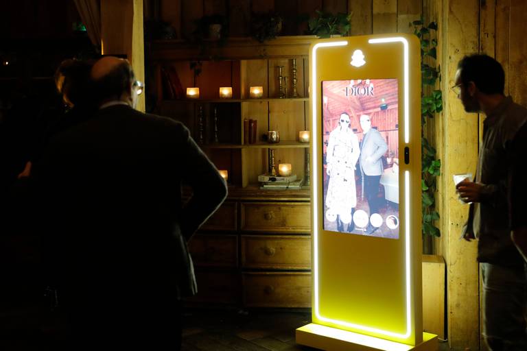 Guests interact with Snap Inc.'s AR mirror onsite at BoF VOICES 2023.